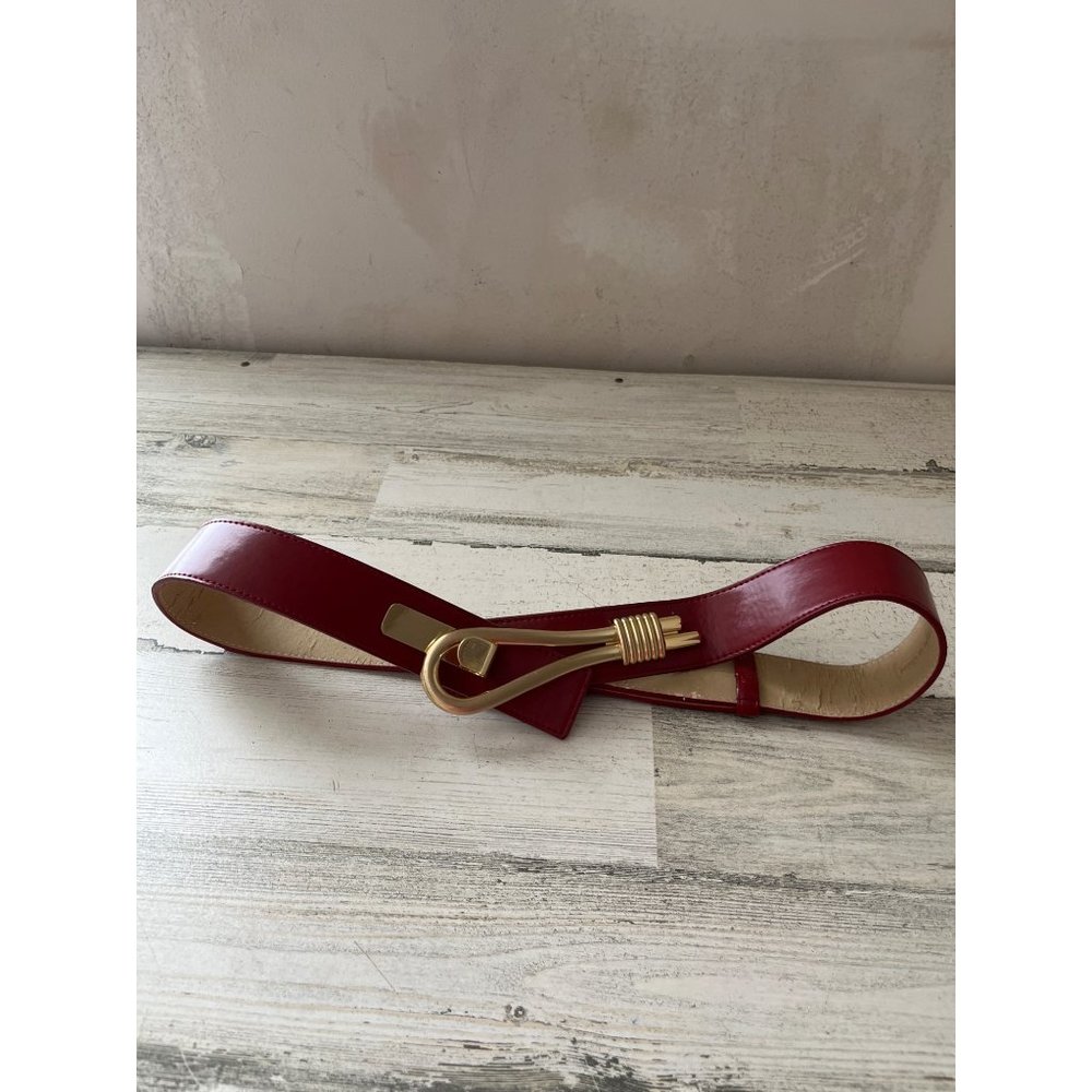Woman’s red and gold tone 1 1/2” belt